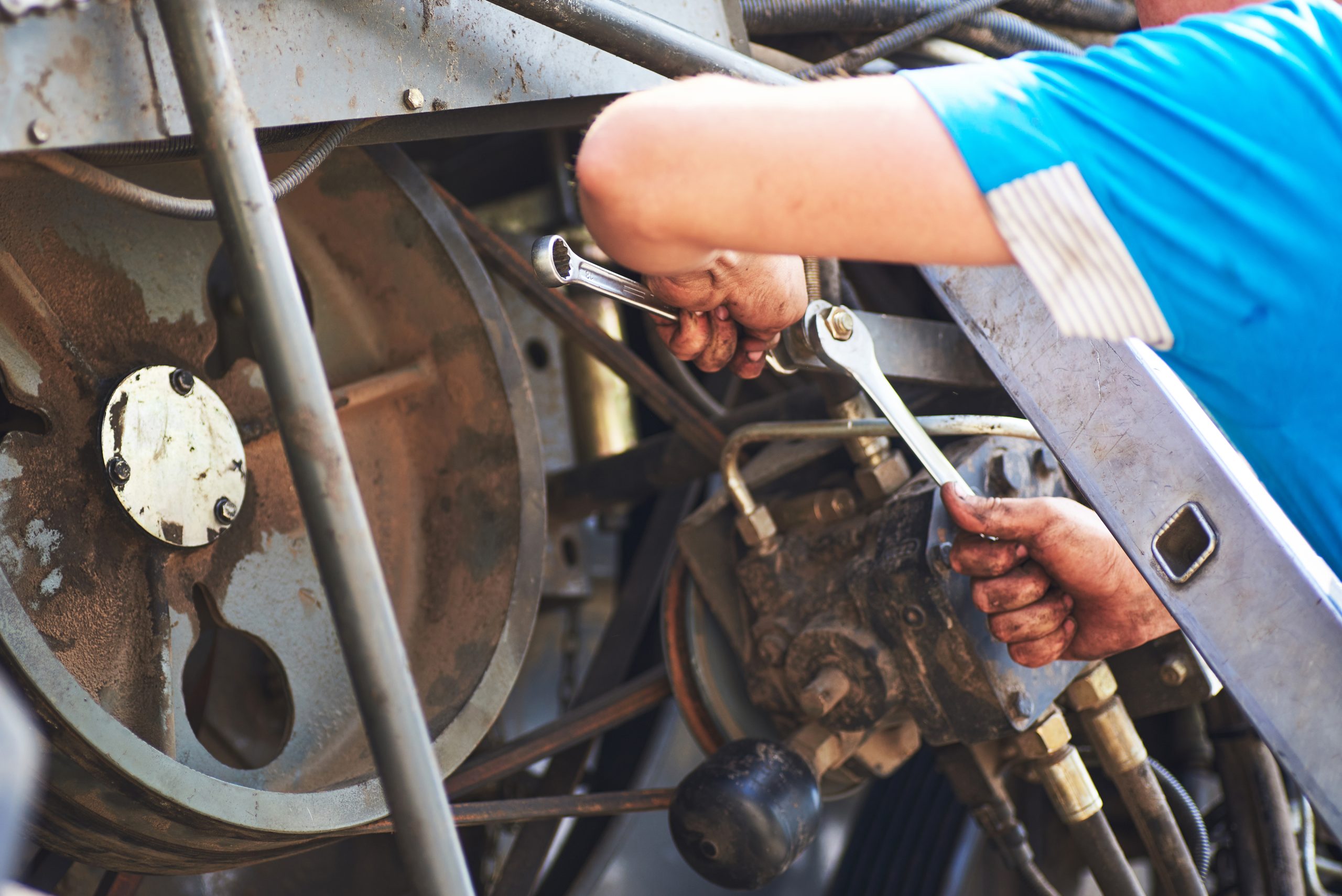 Industrial mechanic working on machinery